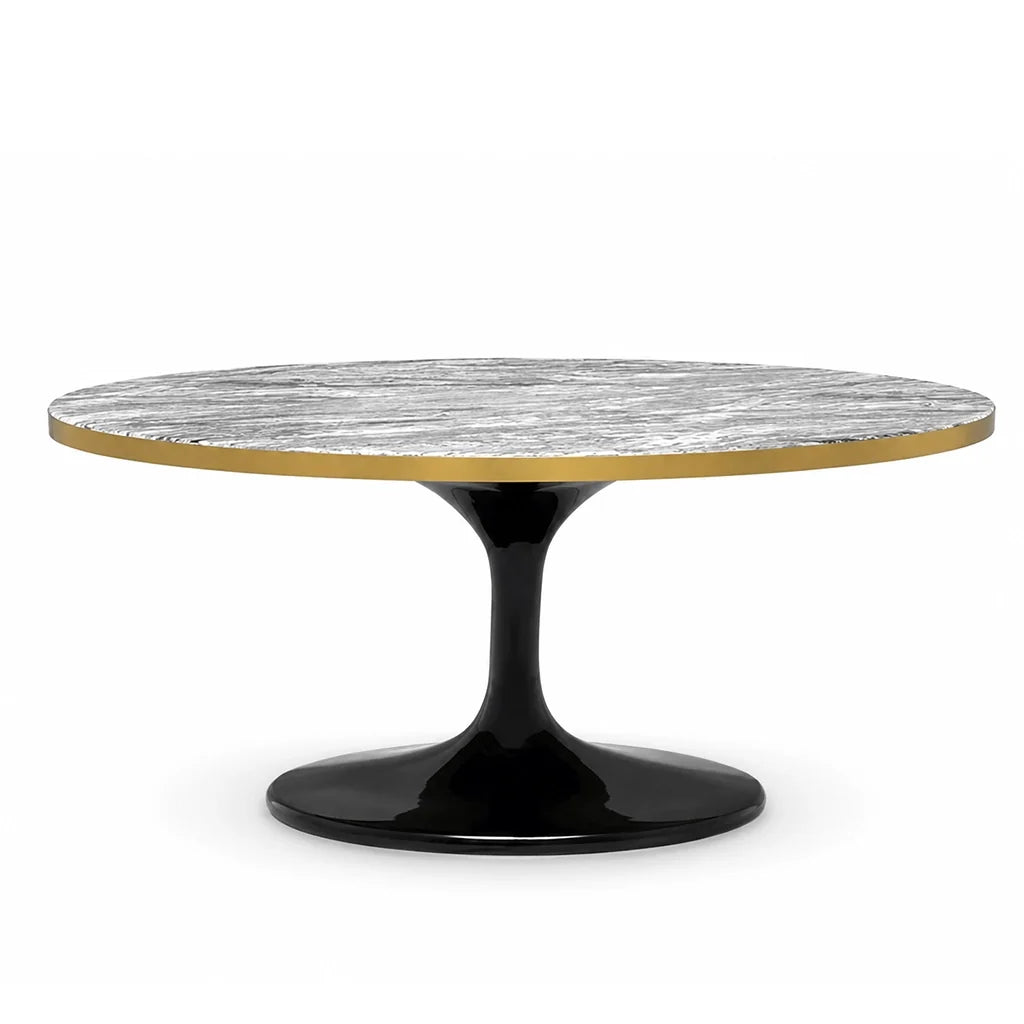 Coffee Table Parme Round Oval. A round dining table with a textured gray and white marble top, a polished gold rim, and a glossy black tulip base, shown on a solid white background.