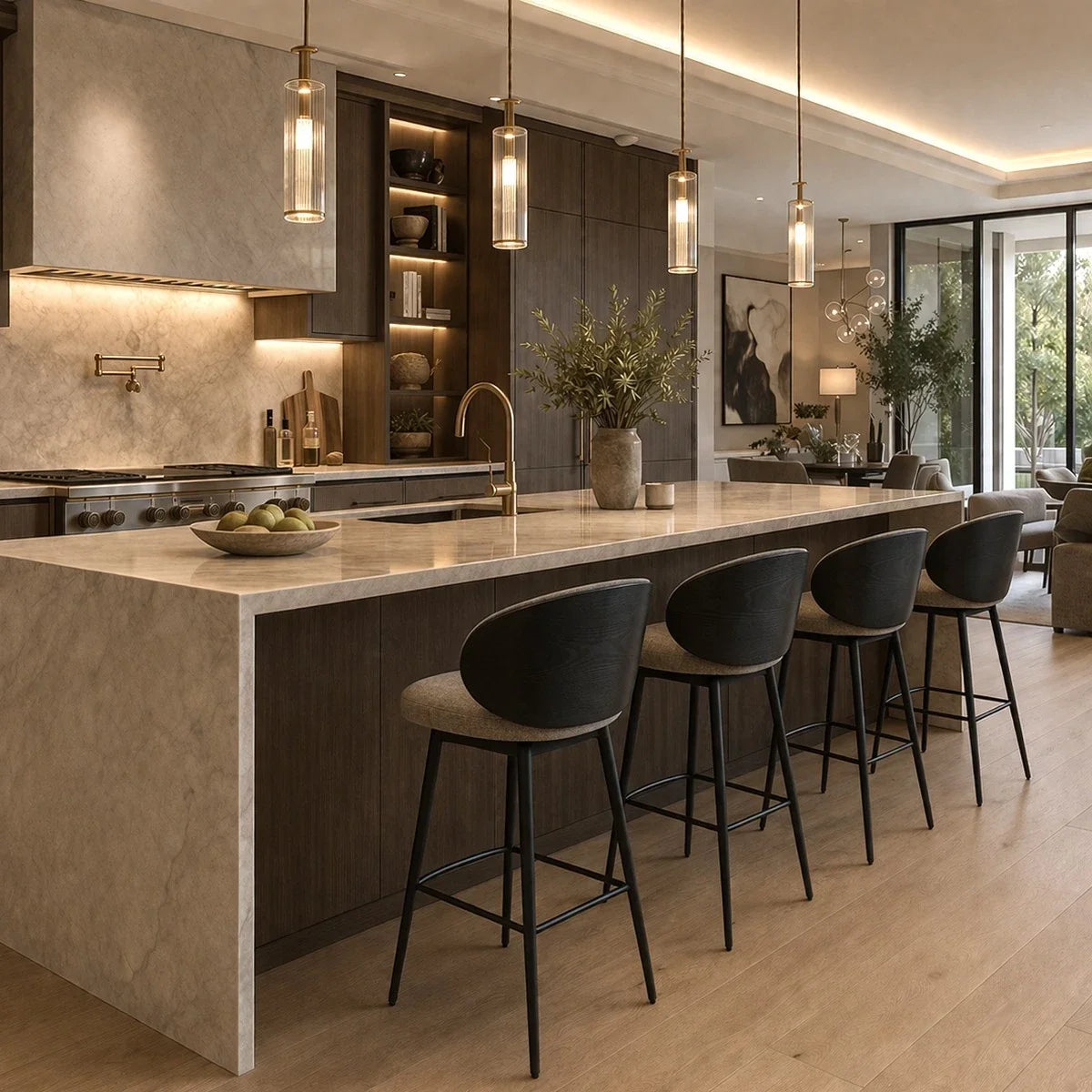 Eichholtz Counter Stool Camerota Scalea Grey. A modern kitchen island with a light beige stone countertop and dark wood base, surrounded by four black bar stools with light gray upholstered seats. The kitchen features warm ambient lighting, built-in shelving, and a large window looking out onto a patio.